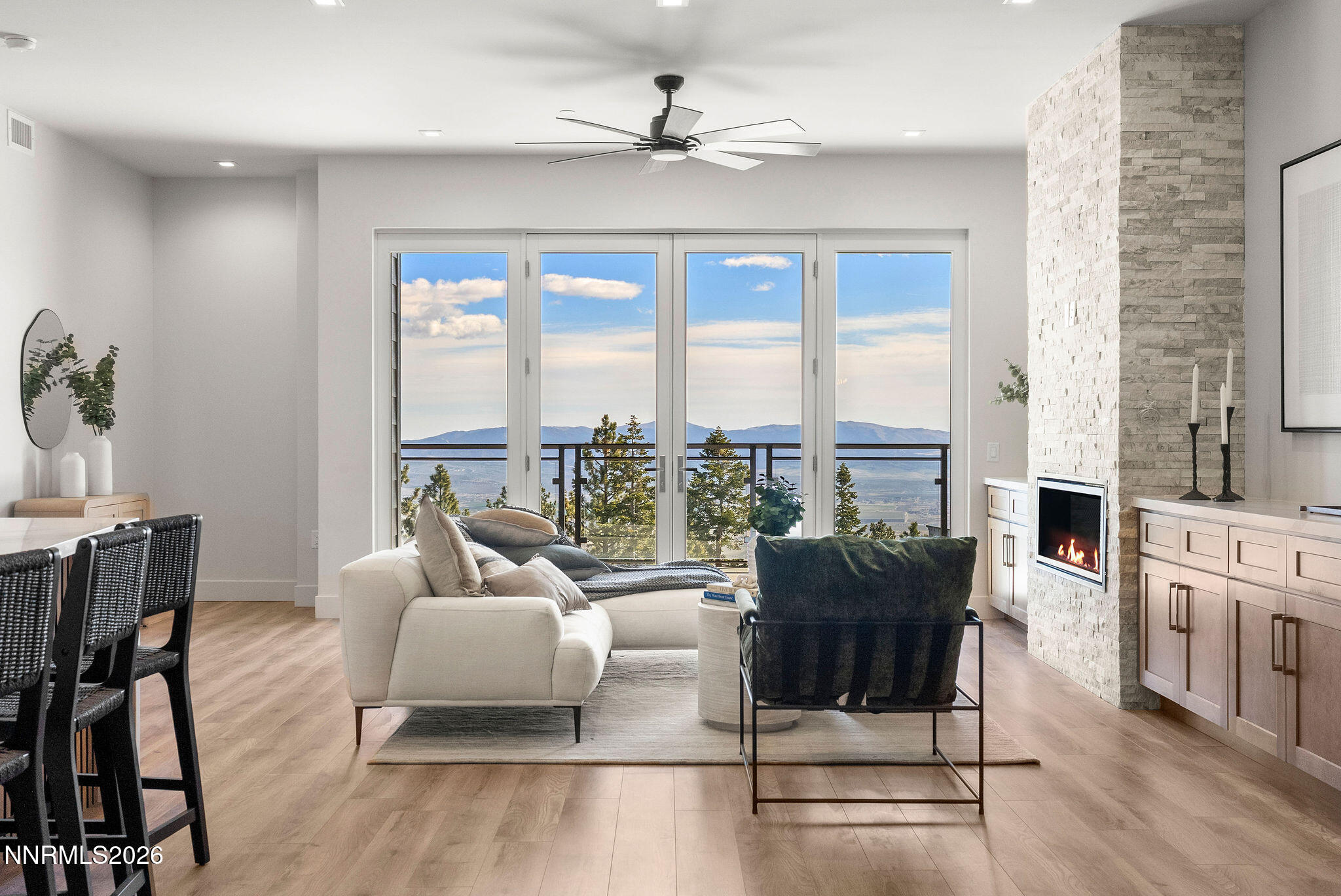 323 Tramway Drive, Unit 107 Stateline, NV 89449 - Photo 2 of 27 a living room with furniture and a floor to ceiling window