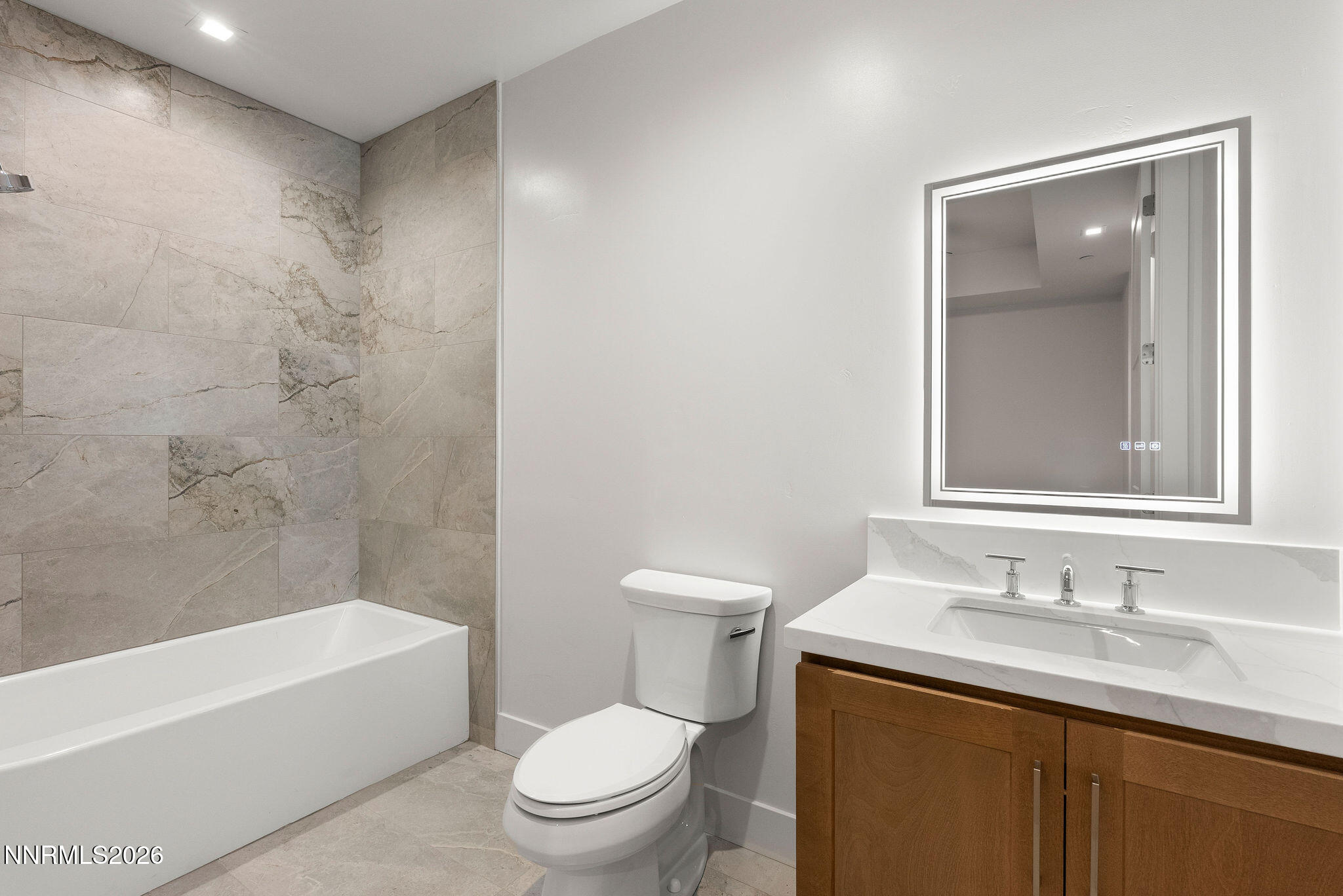 323 Tramway Drive, Unit 107 Stateline, NV 89449 - Photo 21 of 27 a bathroom with a granite countertop sink toilet and shower