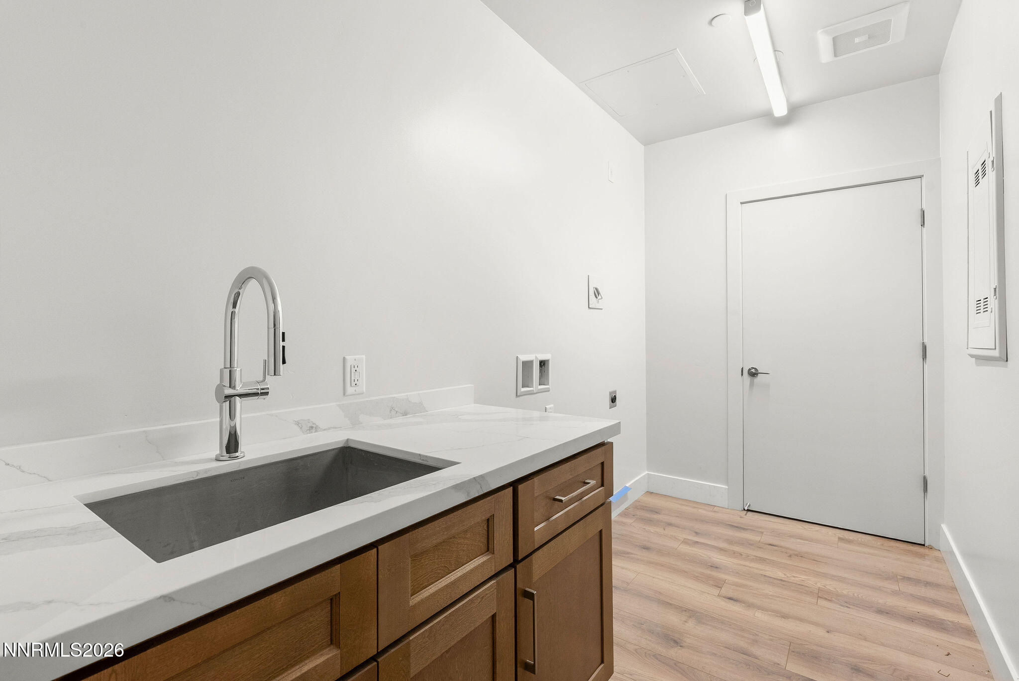 323 Tramway Drive, Unit 107 Stateline, NV 89449 - Photo 24 of 27 a kitchen with a sink and a refrigerator