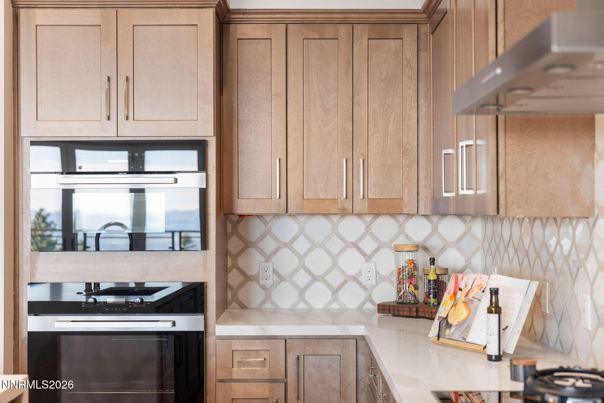 323 Tramway Drive, Unit 107 Stateline, NV 89449 - Photo 6 of 27 a kitchen with stainless steel appliances granite countertop a stove and a refrigerator
