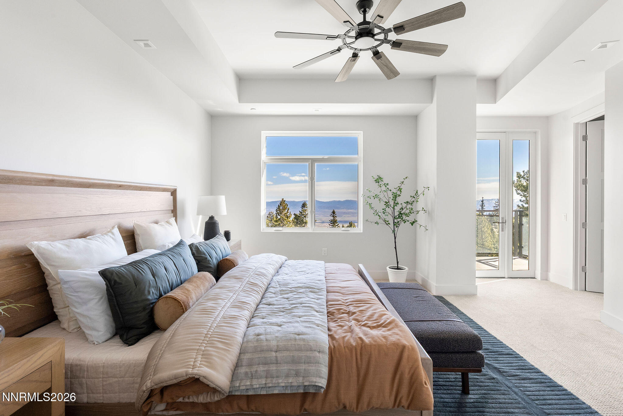 323 Tramway Drive, Unit 107 Stateline, NV 89449 - Photo 10 of 27 a bedroom with a large bed and a window