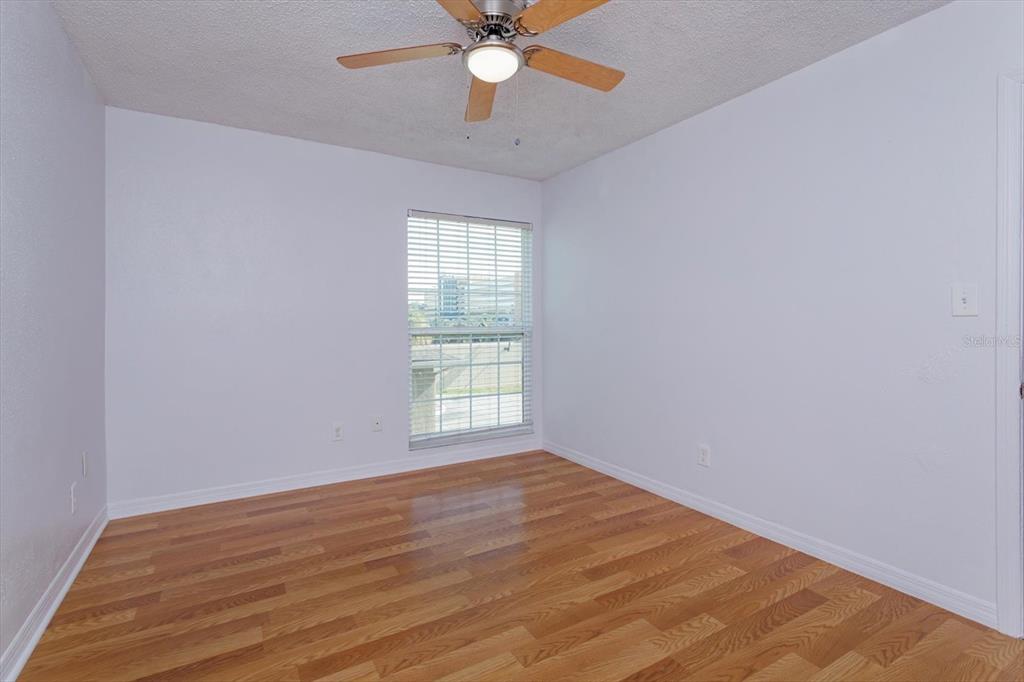395 Wymore Road, Unit 207 Altamonte Springs, FL 32714 - Photo 18 of 32 wooden floor in an empty room with a window