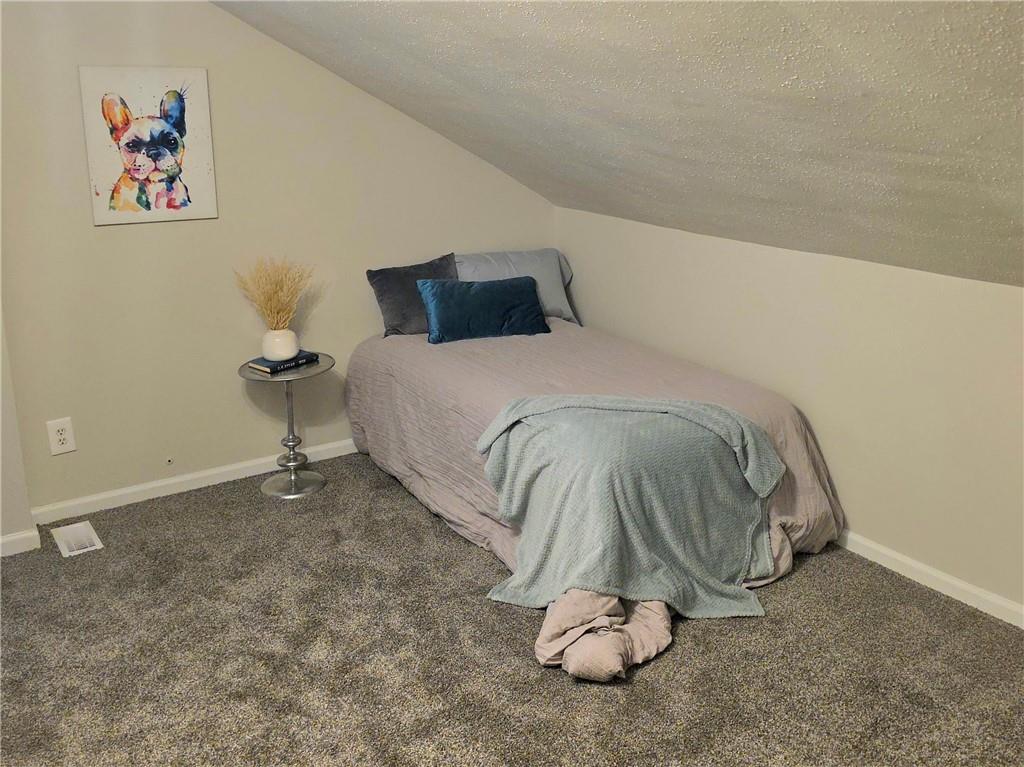 5232 Keystone Street Pittsburgh, PA 15201 - Photo 12 of 48 a bedroom with a bed and a table