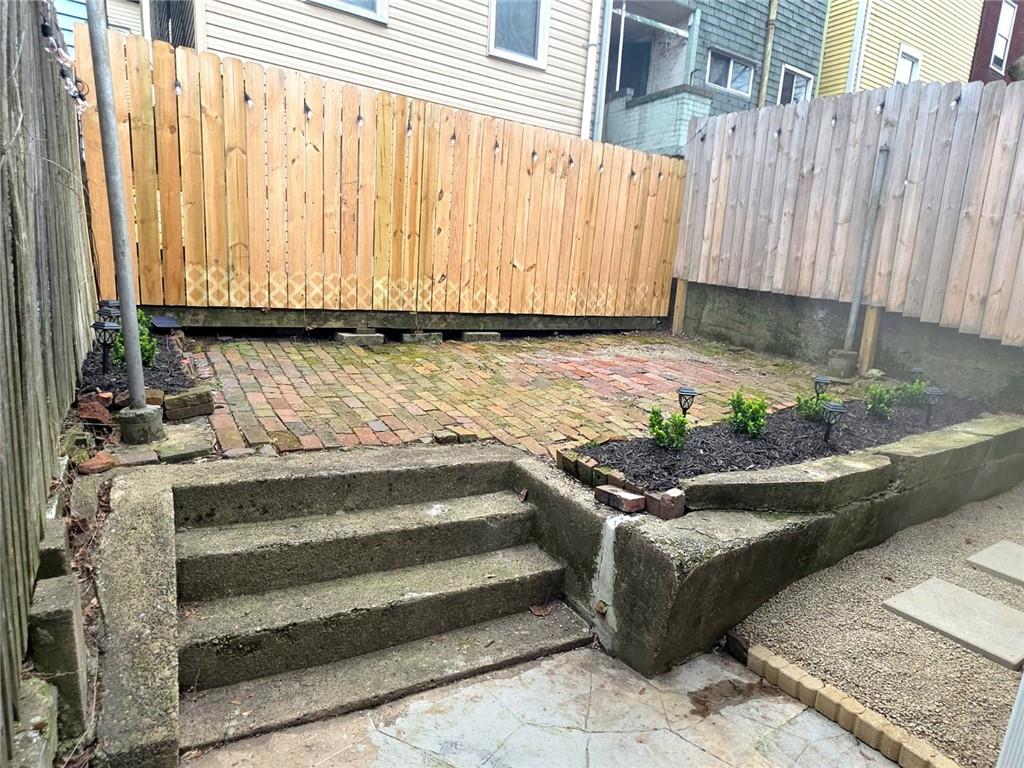 5232 Keystone Street Pittsburgh, PA 15201 - Photo 16 of 48 a view of a garden with wooden fence