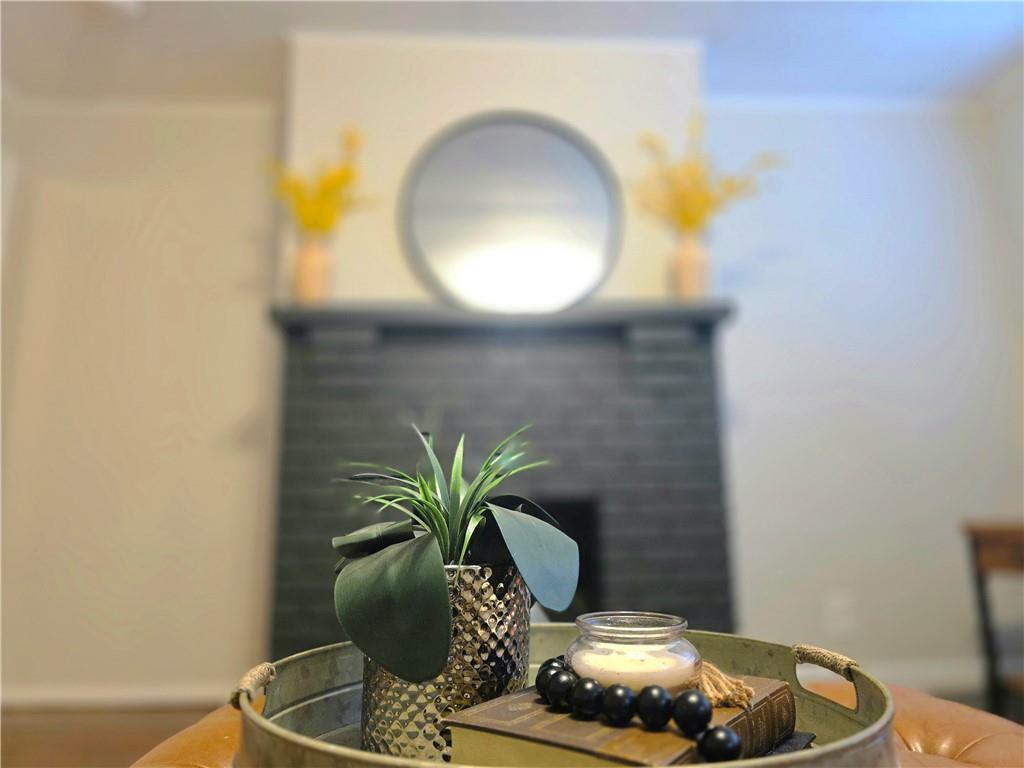 5232 Keystone Street Pittsburgh, PA 15201 - Photo 20 of 48 a table with a vase and flowers on it