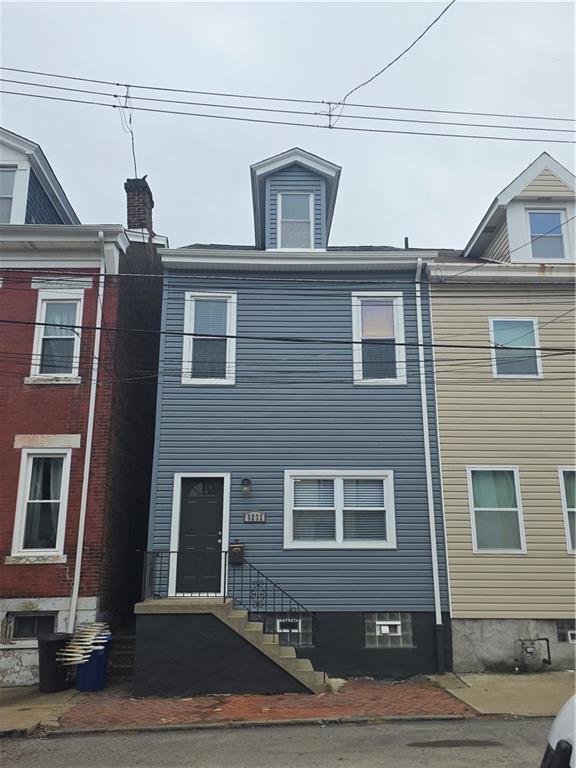 5232 Keystone Street Pittsburgh, PA 15201 - Photo 2 of 48 a front view of a house with a yard
