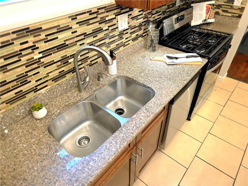 5232 Keystone Street Pittsburgh, PA 15201 - Photo 30 of 48 a bathroom with a granite countertop sink and mirror