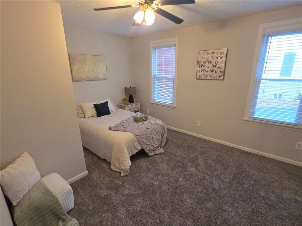 5232 Keystone Street Pittsburgh, PA 15201 - Photo 33 of 48 a bed sitting in a bedroom next to a window