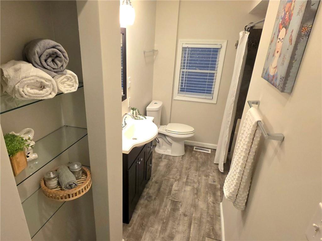 5232 Keystone Street Pittsburgh, PA 15201 - Photo 36 of 48 a bathroom with a toilet and a mirror