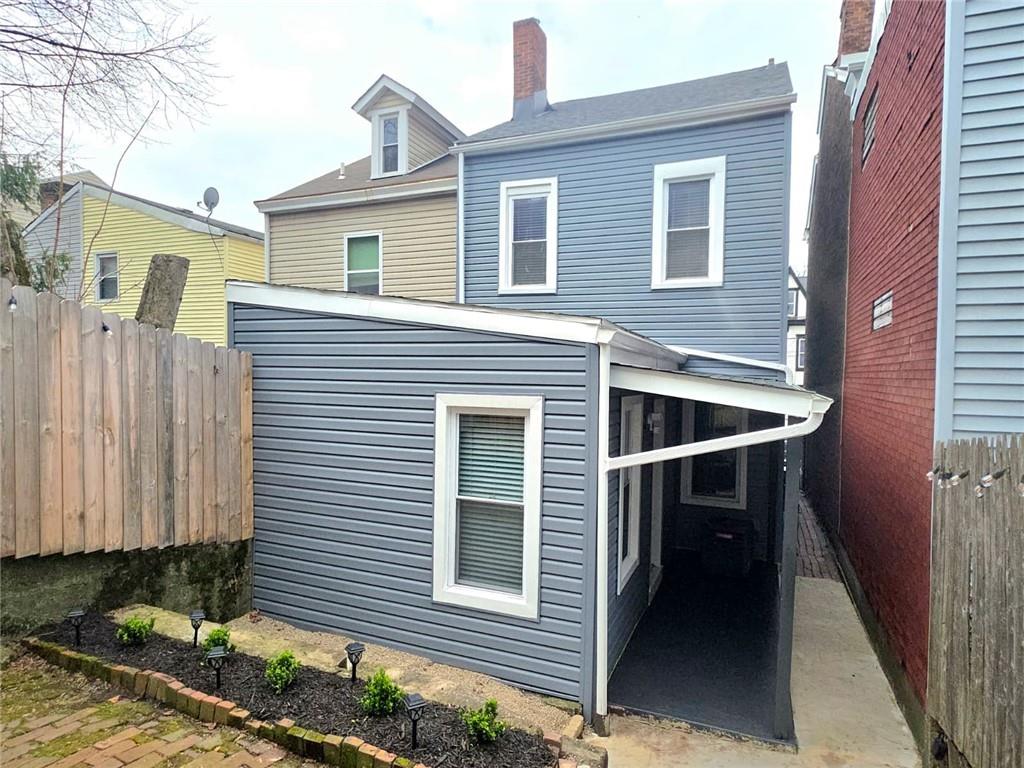 5232 Keystone Street Pittsburgh, PA 15201 - Photo 44 of 48 a front view of a house with a yard
