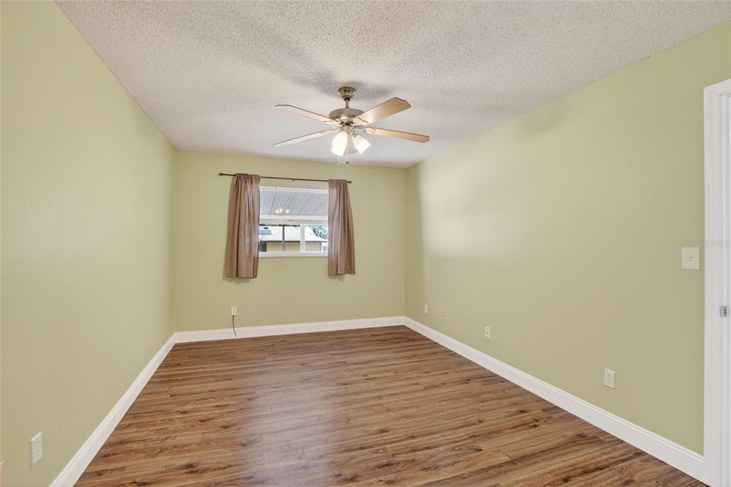 2340 Merrily Circle South Seffner, FL 33584 - Photo 18 of 52 wooden floor in an empty room