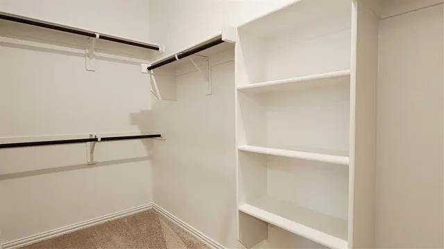 a view of an empty walk in closet