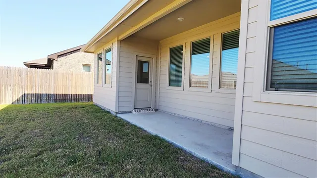 a view of a back yard of the house