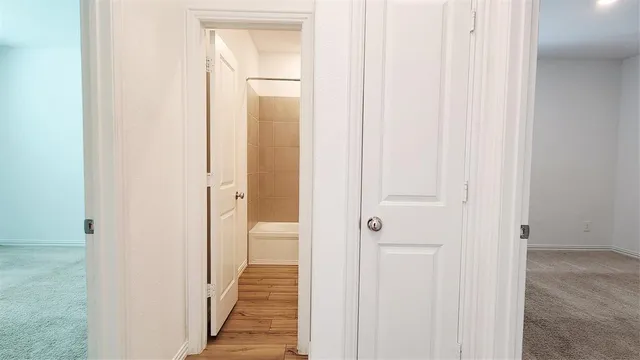 a view of a bathroom from the hallway