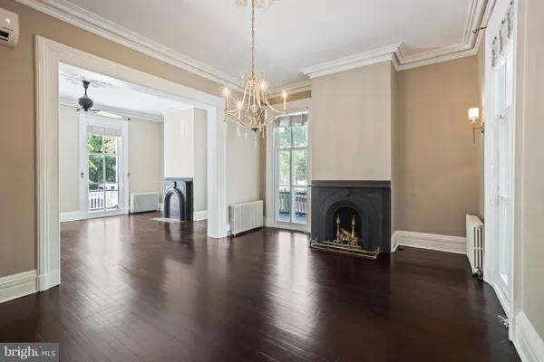 a view of an entryway with wooden floor