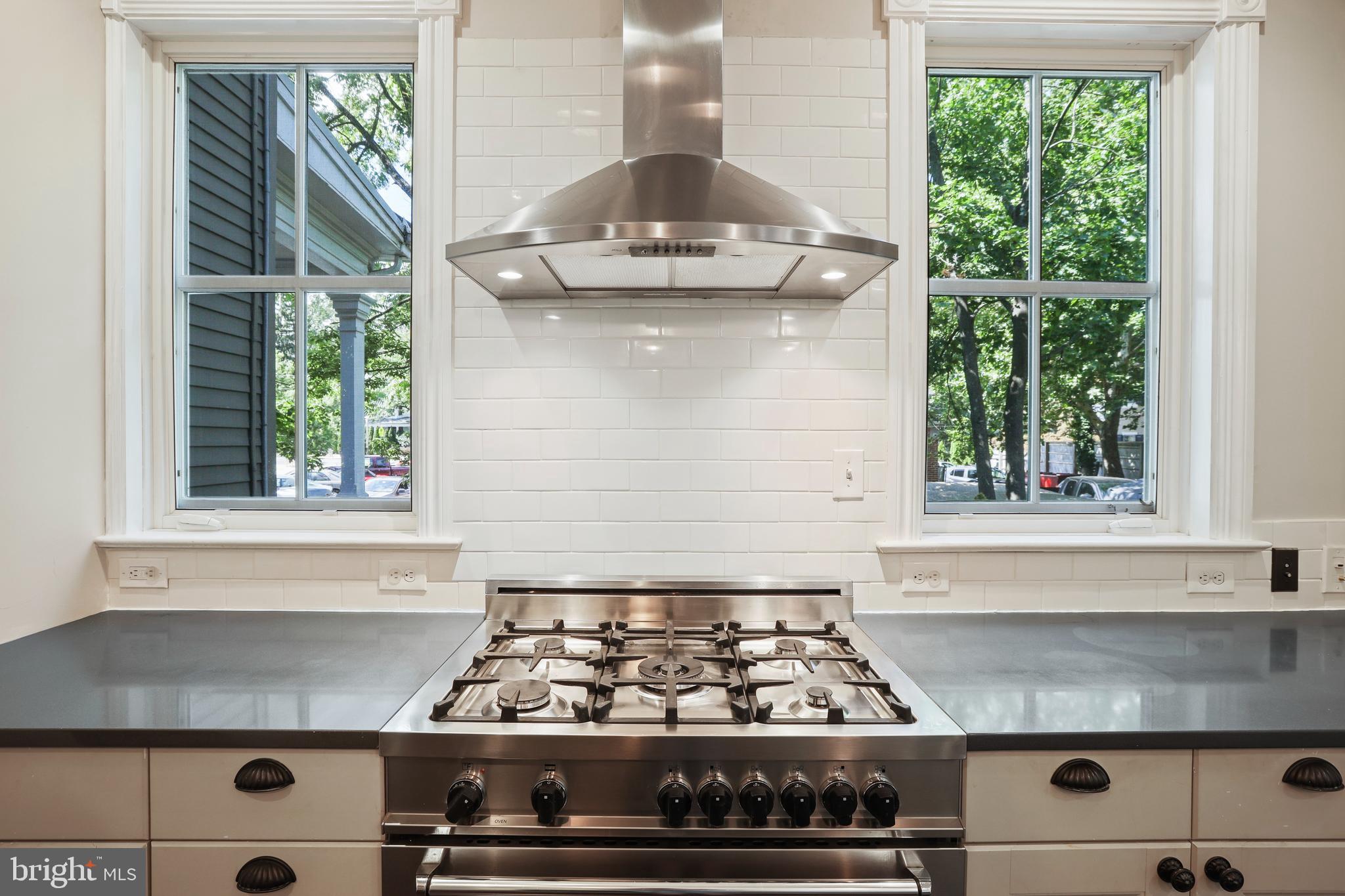 12 Murray Place Princeton, NJ 08540 - Photo 26 of 47 a kitchen with a stove a window cabinets and a counter top space