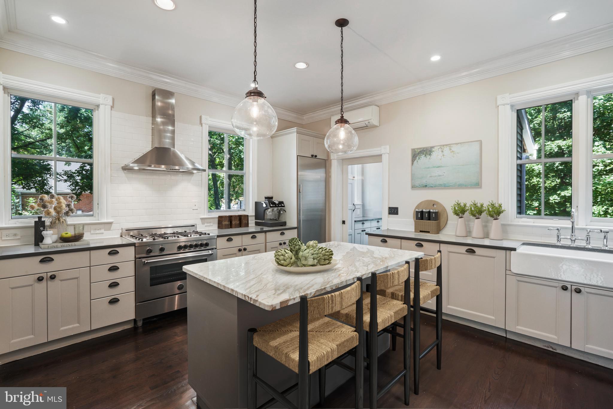 12 Murray Place Princeton, NJ 08540 - Photo 6 of 47 a kitchen with stainless steel appliances granite countertop a stove a kitchen island a table and chairs