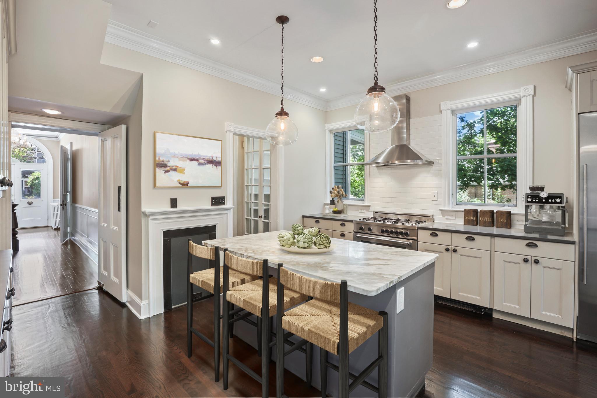 12 Murray Place Princeton, NJ 08540 - Photo 7 of 47 a kitchen with stainless steel appliances granite countertop a stove a sink a refrigerator a center island a stove and a wooden floors