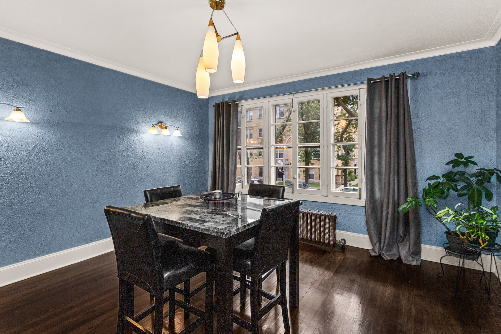 7523 North Seeley Avenue, Unit 1 Chicago, IL 60645 - Photo 7 of 18 a view of a dining room with furniture window and wooden floor