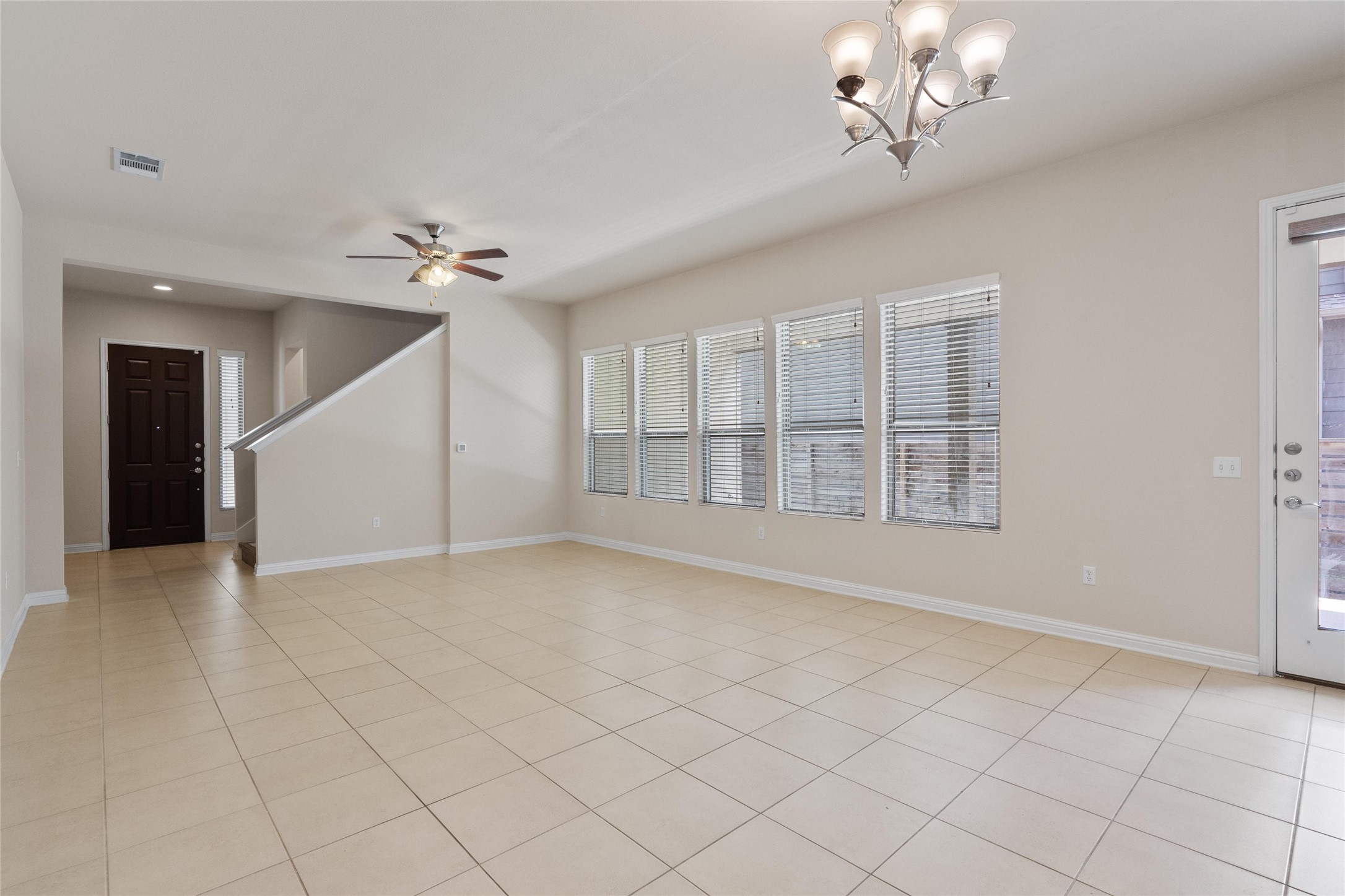 6907 Idea Road Austin, TX 78741 - Photo 5 of 36 a view of an empty room with chandelier fan