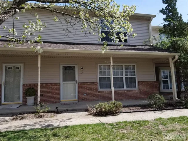 a view of house with yard