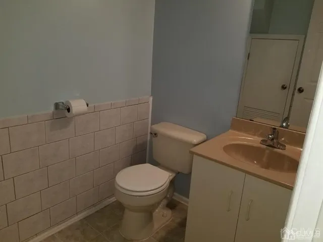 a bathroom with a sink and toilet