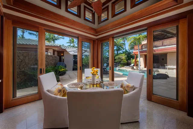a view of a dining room with furniture wooden floor and a chandelier