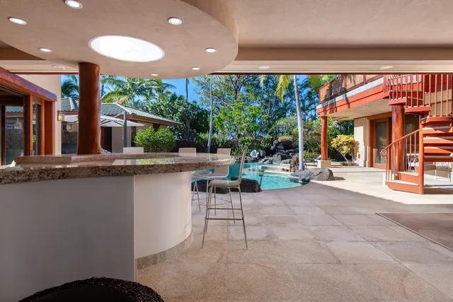 a view of a patio with a table and chairs