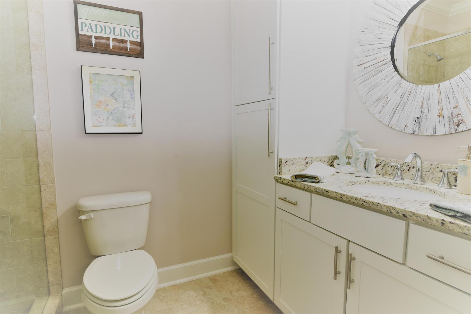 257 Driftwood Road, Unit 2 Miramar Beach, FL 32550 - Photo 32 of 41 a bathroom with a granite countertop toilet sink and mirror