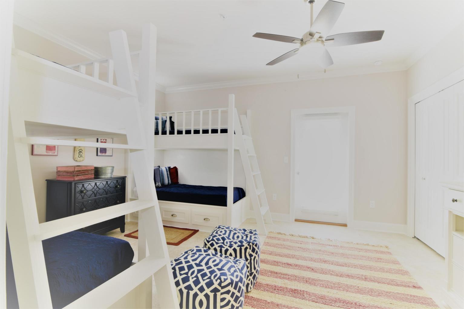 257 Driftwood Road, Unit 2 Miramar Beach, FL 32550 - Photo 9 of 41 a bedroom with furniture and a chandelier