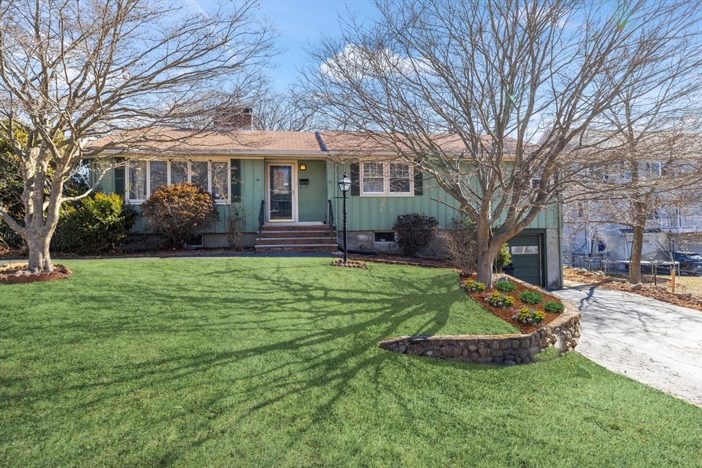 14 Bacon Drive Saugus, MA 01906 - Photo 1 of 8 a front view of a house with garden and porch