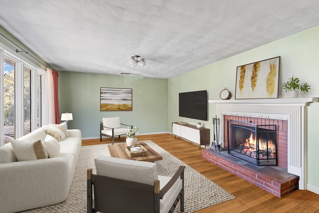 14 Bacon Drive Saugus, MA 01906 - Photo 4 of 8 a living room with furniture and a fireplace