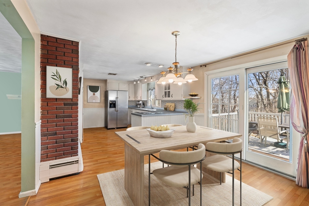 14 Bacon Drive Saugus, MA 01906 - Photo 5 of 8 a view of a dining room with furniture window and wooden floor