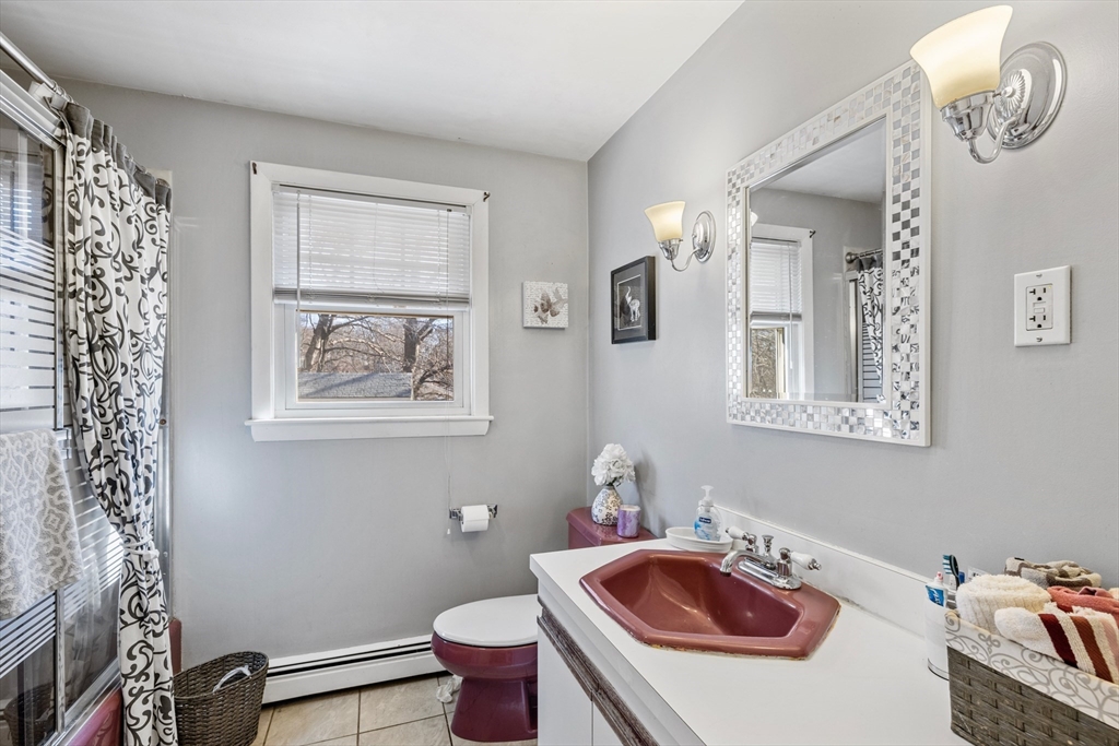 14 Bacon Drive Saugus, MA 01906 - Photo 7 of 8 a bathroom with a sink toilet and mirror