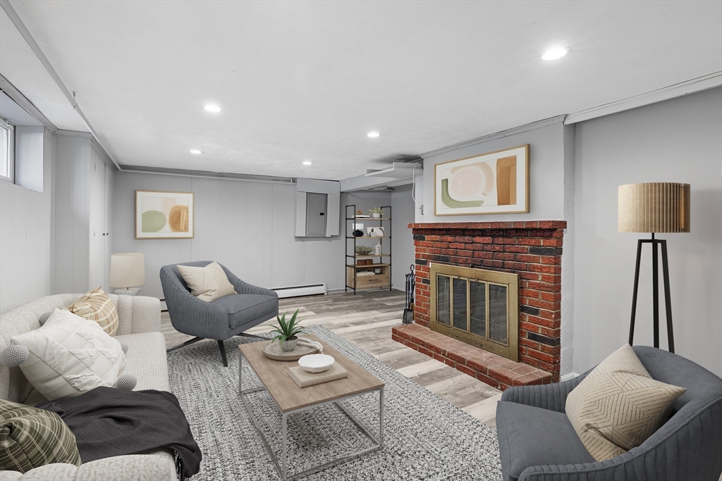 14 Bacon Drive Saugus, MA 01906 - Photo 8 of 8 a living room with furniture and a fireplace