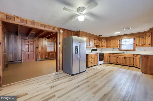 a kitchen with sink cabinets and window