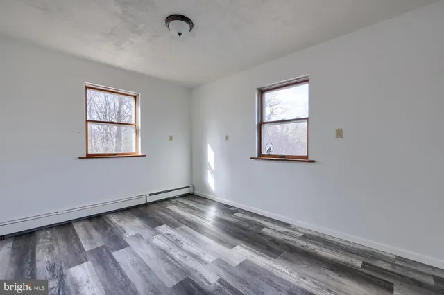 a view of front door with wooden floor