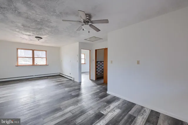 a view of a bathtub and a shower curtain