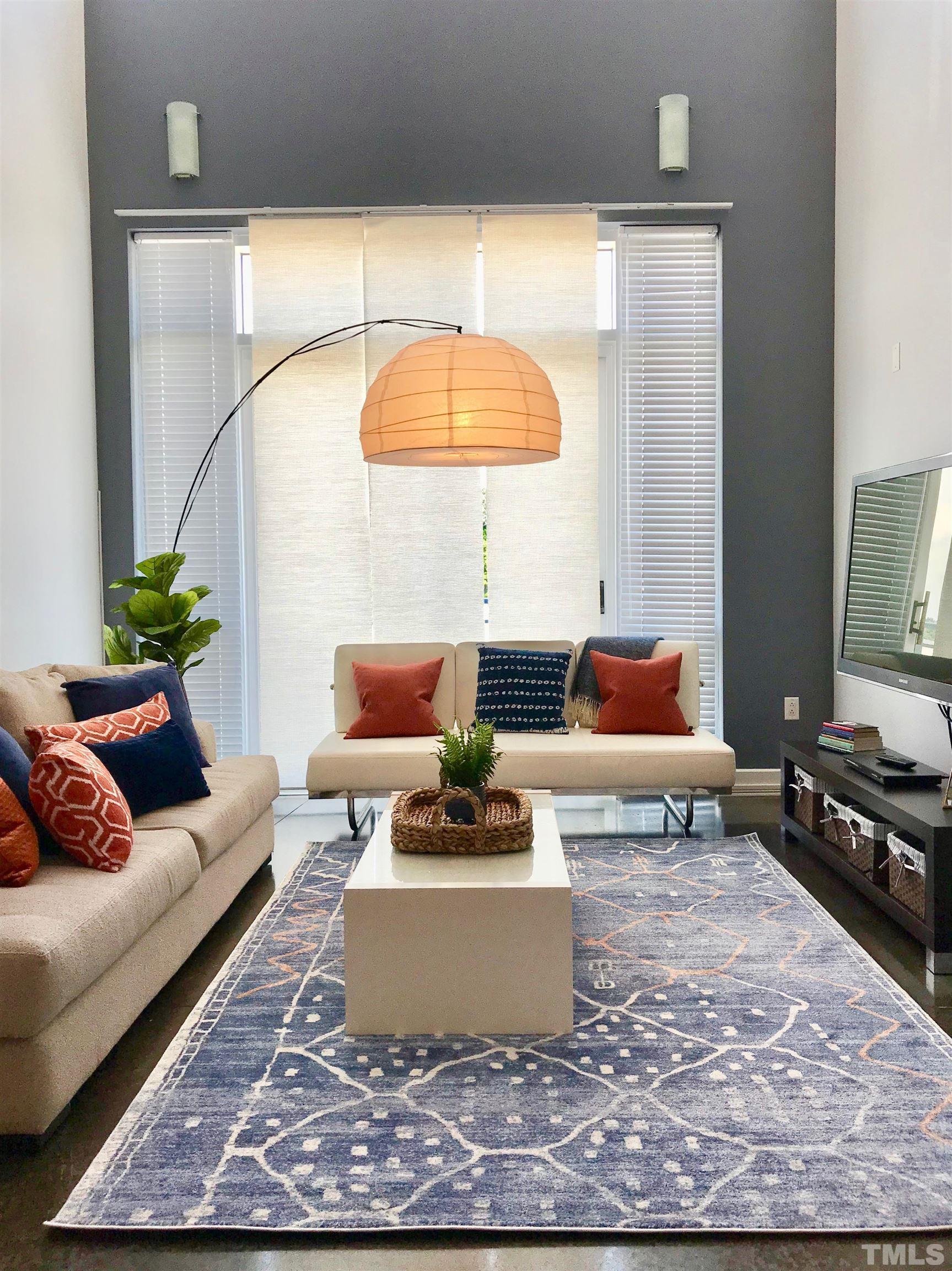 2608 Erwin Road, Unit 417 Durham, NC 27705 - Photo 11 of 39 a living room with furniture and a potted plant