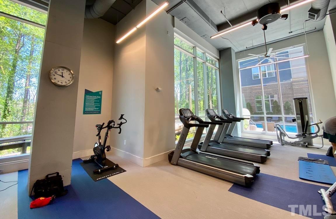 2608 Erwin Road, Unit 417 Durham, NC 27705 - Photo 36 of 39 a living room with furniture gym equipment and a large window