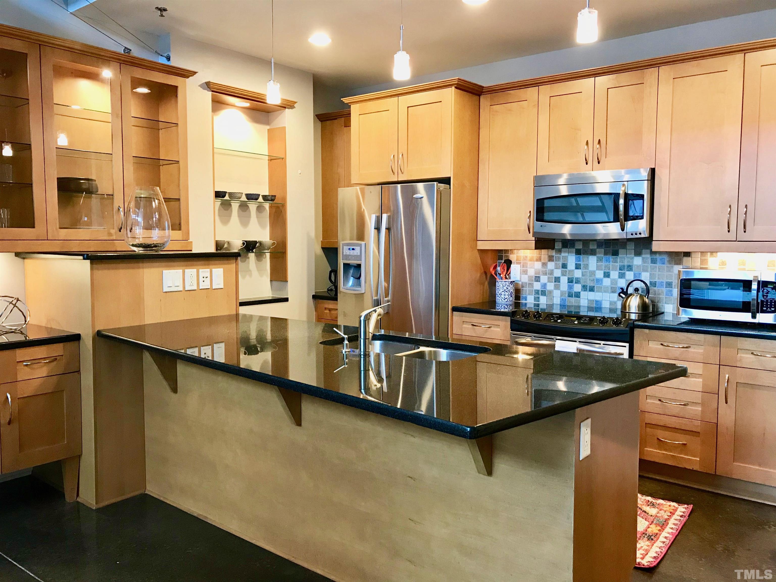 2608 Erwin Road, Unit 417 Durham, NC 27705 - Photo 9 of 39 a kitchen with stainless steel appliances granite countertop a sink a stove and a refrigerator