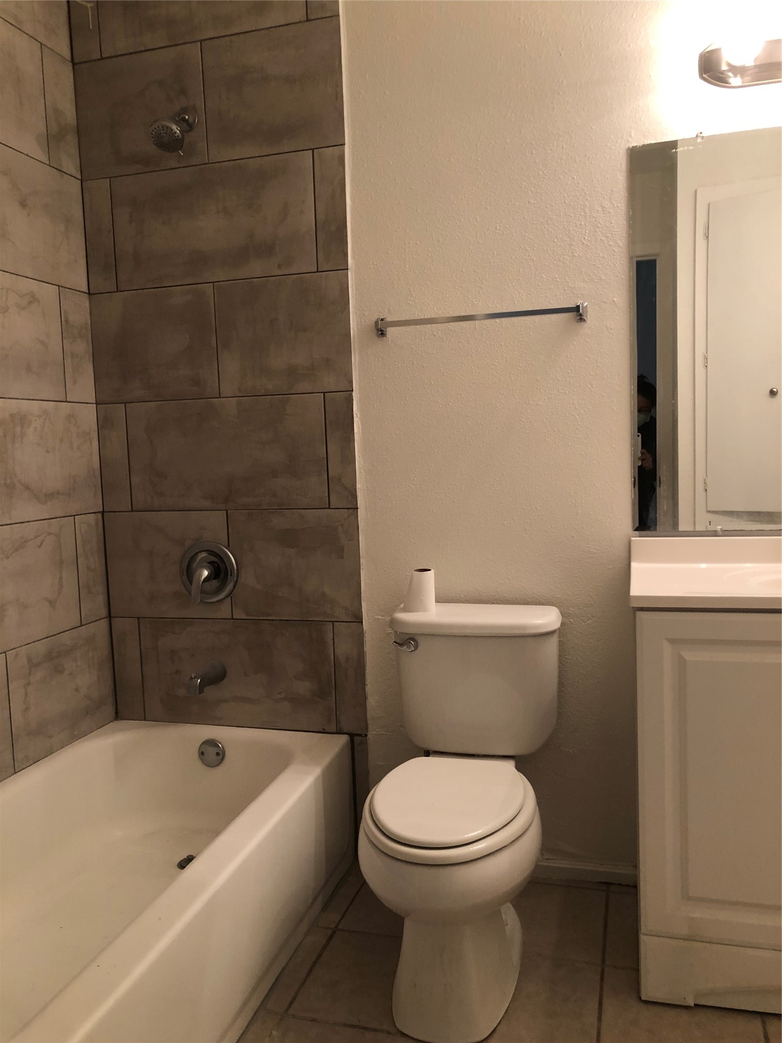 6502 South 1st Street, Unit 102 Austin, TX 78745 - Photo 25 of 26 a white toilet sitting next to a bath tub
