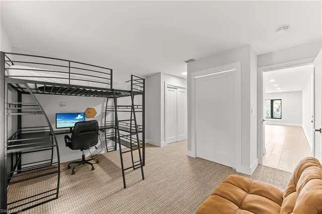 a view of a livingroom with furniture and staircase