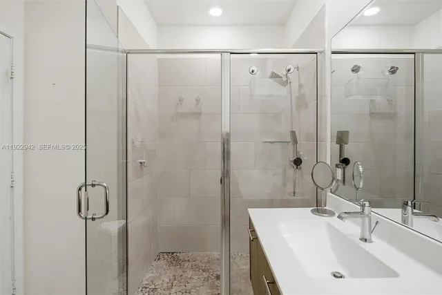 a room with furniture pool table and flat screen tv