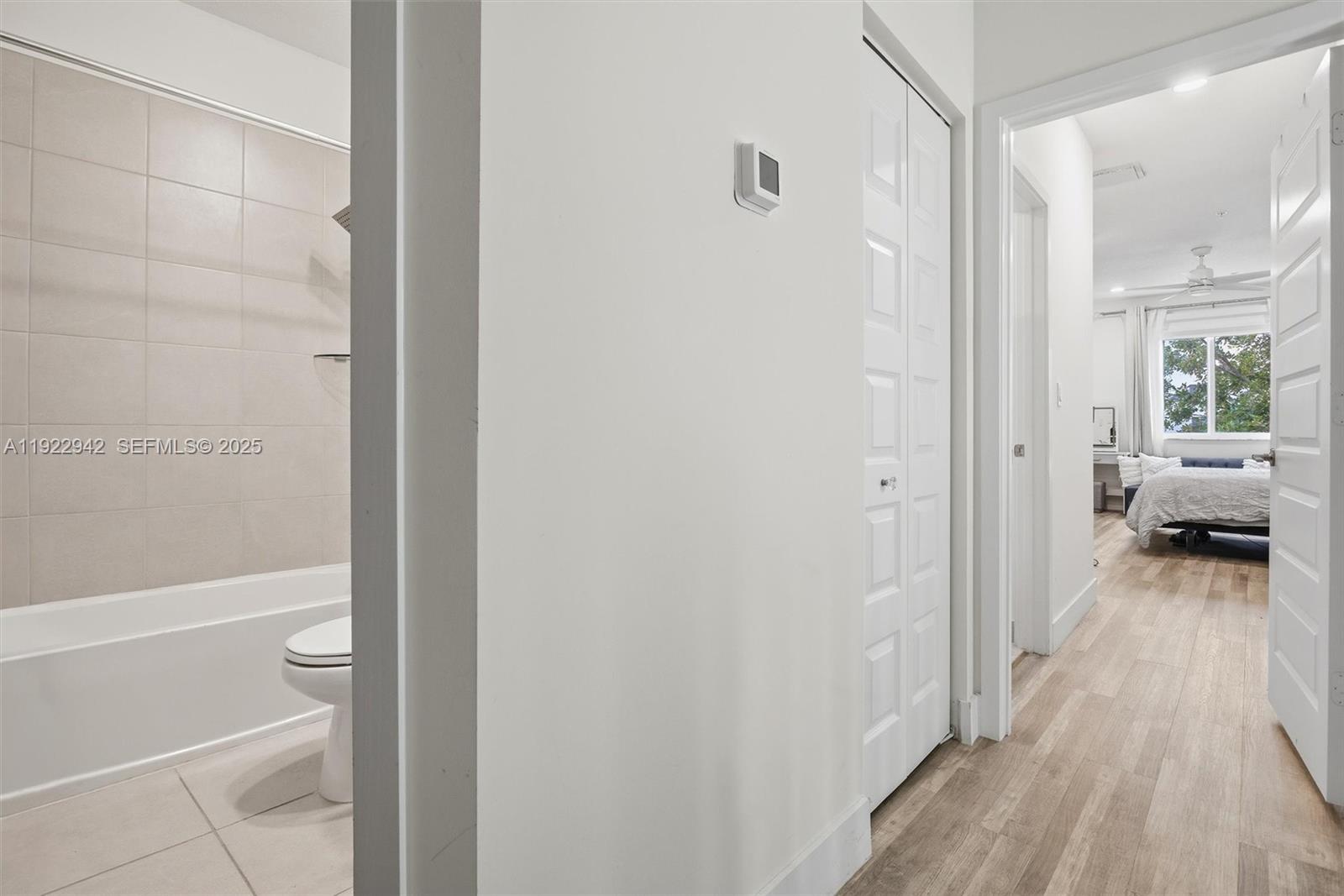 6420 Northwest 102nd Path, Unit 110 Doral, FL 33178 - Photo 29 of 47 a view of a bathroom from a hallway