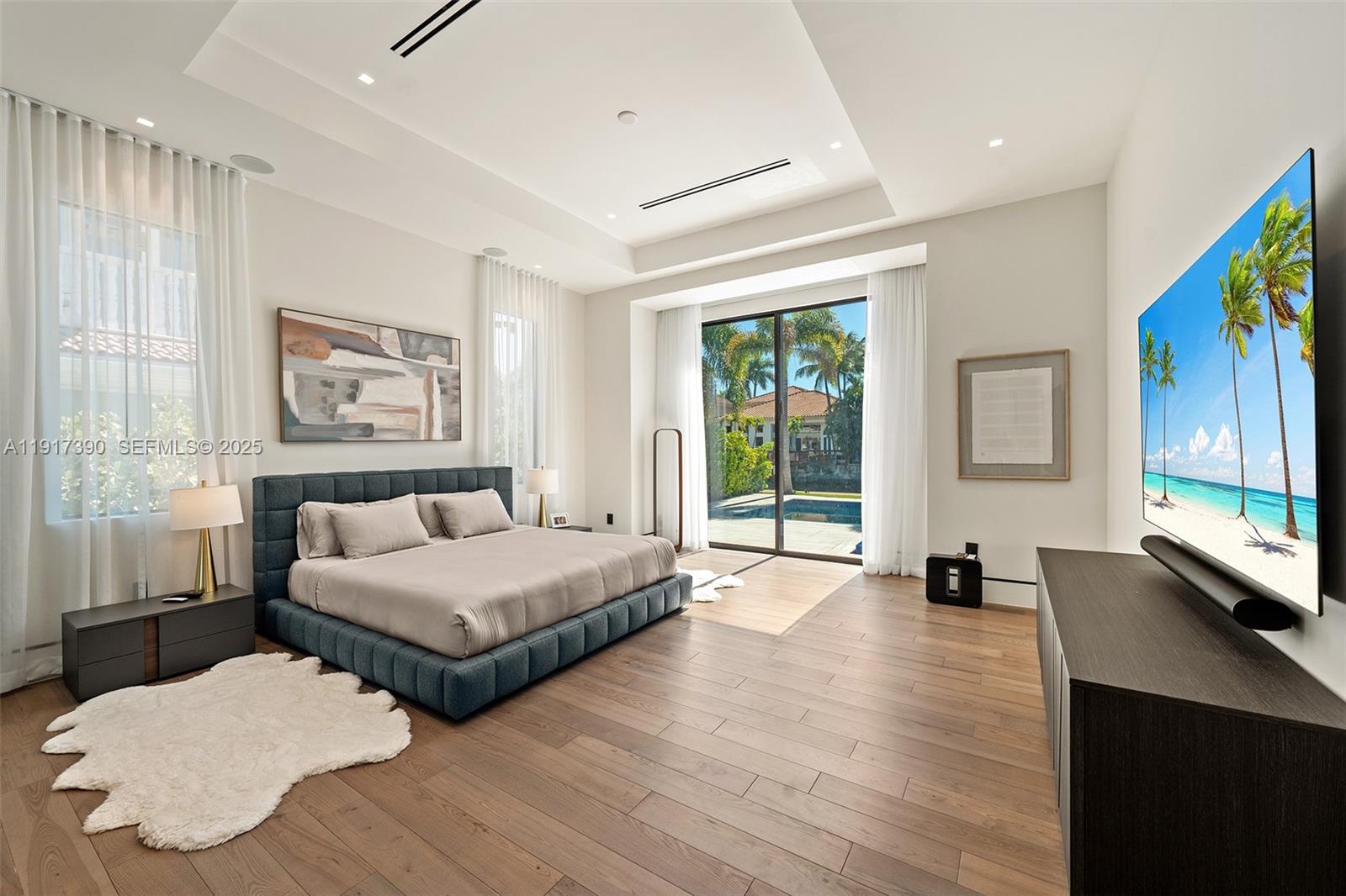 900 Washington Street Hollywood, FL 33019 - Photo 25 of 61 a spacious bedroom with two beds and a large window