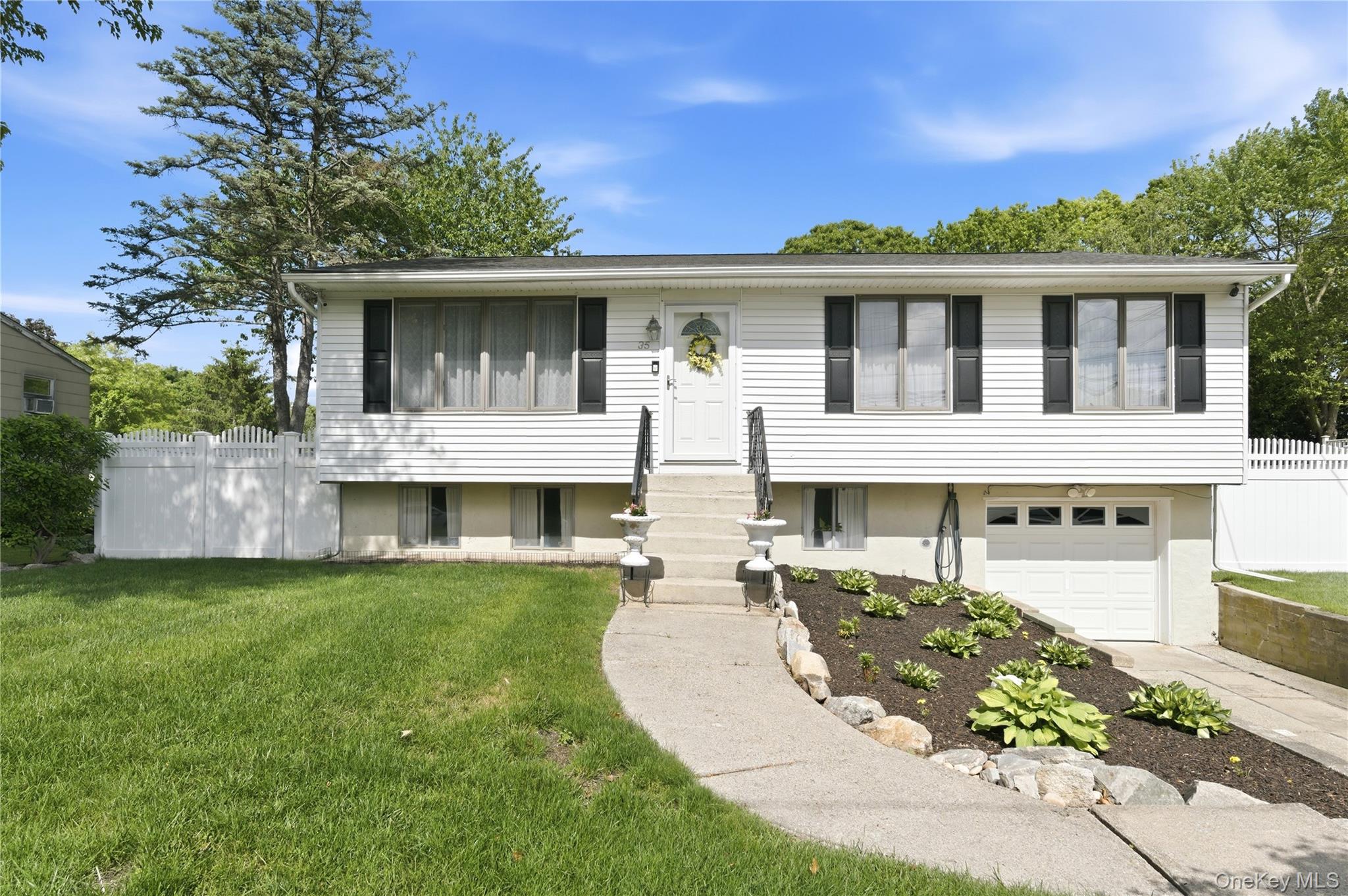 35 Randall Road Shoreham, NY 11786 - Photo 3 of 32 front view of a house with a yard