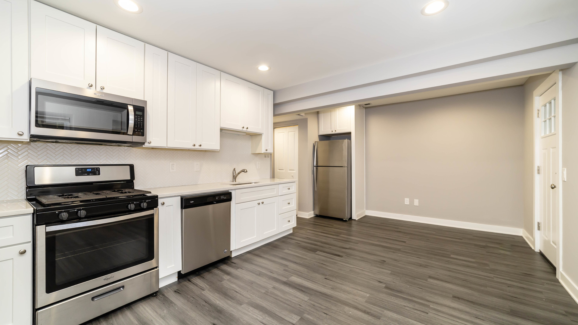 2246 South Whipple Street, Unit 2F Chicago, IL 60623 - Photo 2 of 10 a kitchen with stainless steel appliances a stove a microwave and sink
