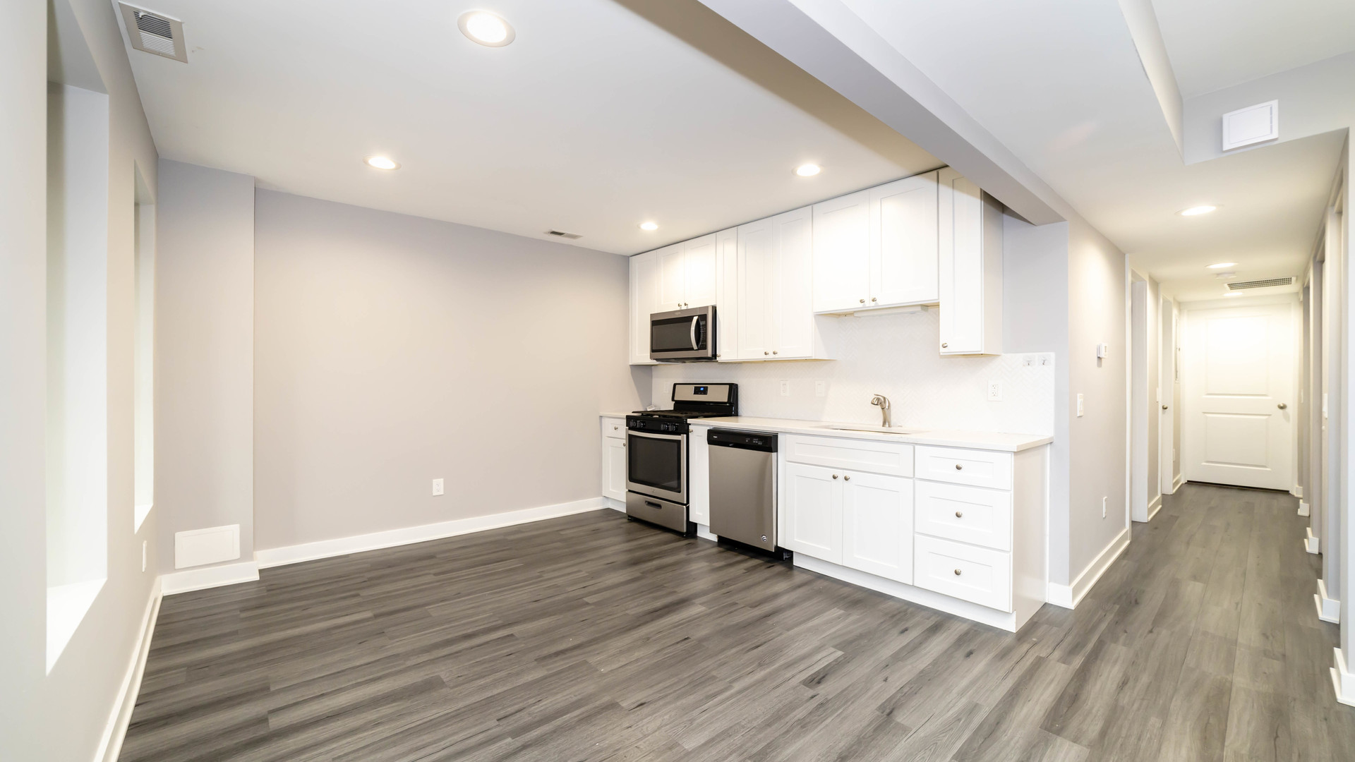 2246 South Whipple Street, Unit 2F Chicago, IL 60623 - Photo 3 of 10 a kitchen with wooden floors and white appliances