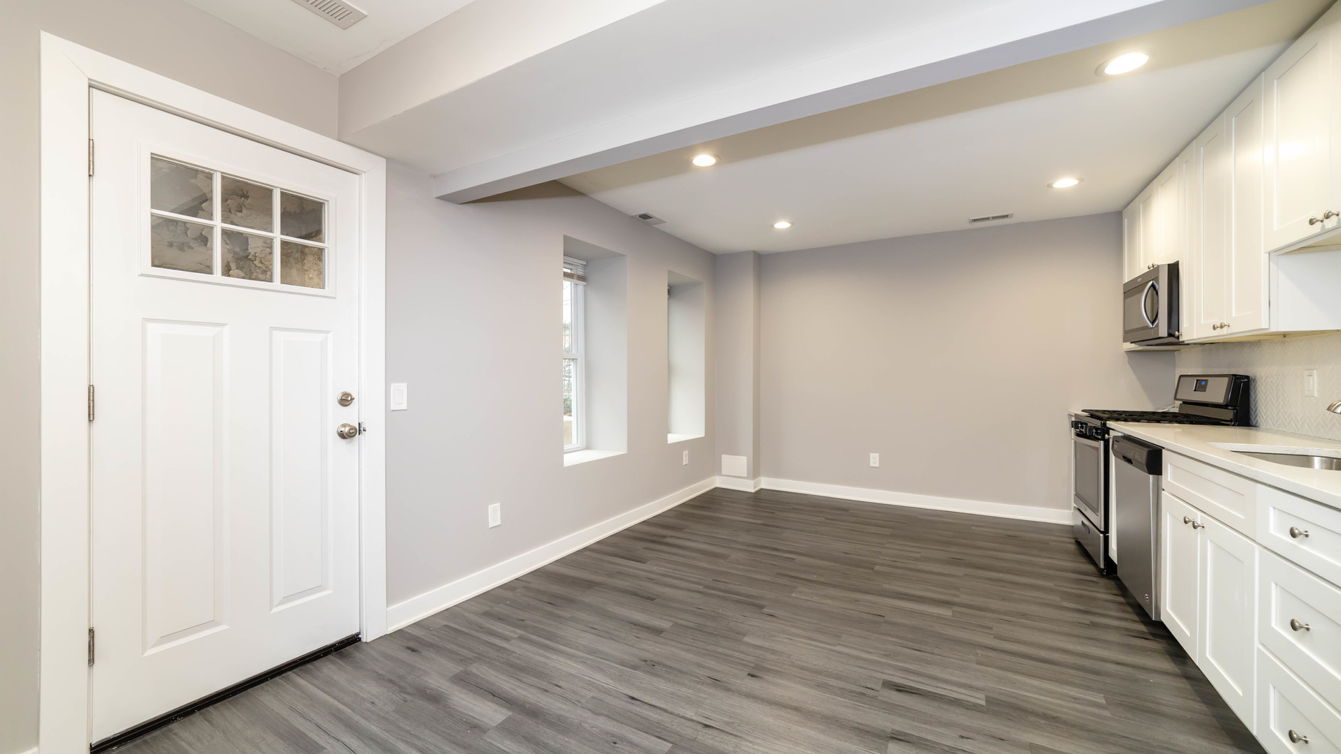 2246 South Whipple Street, Unit 2F Chicago, IL 60623 - Photo 4 of 10 a view of a kitchen with wooden floor and a window
